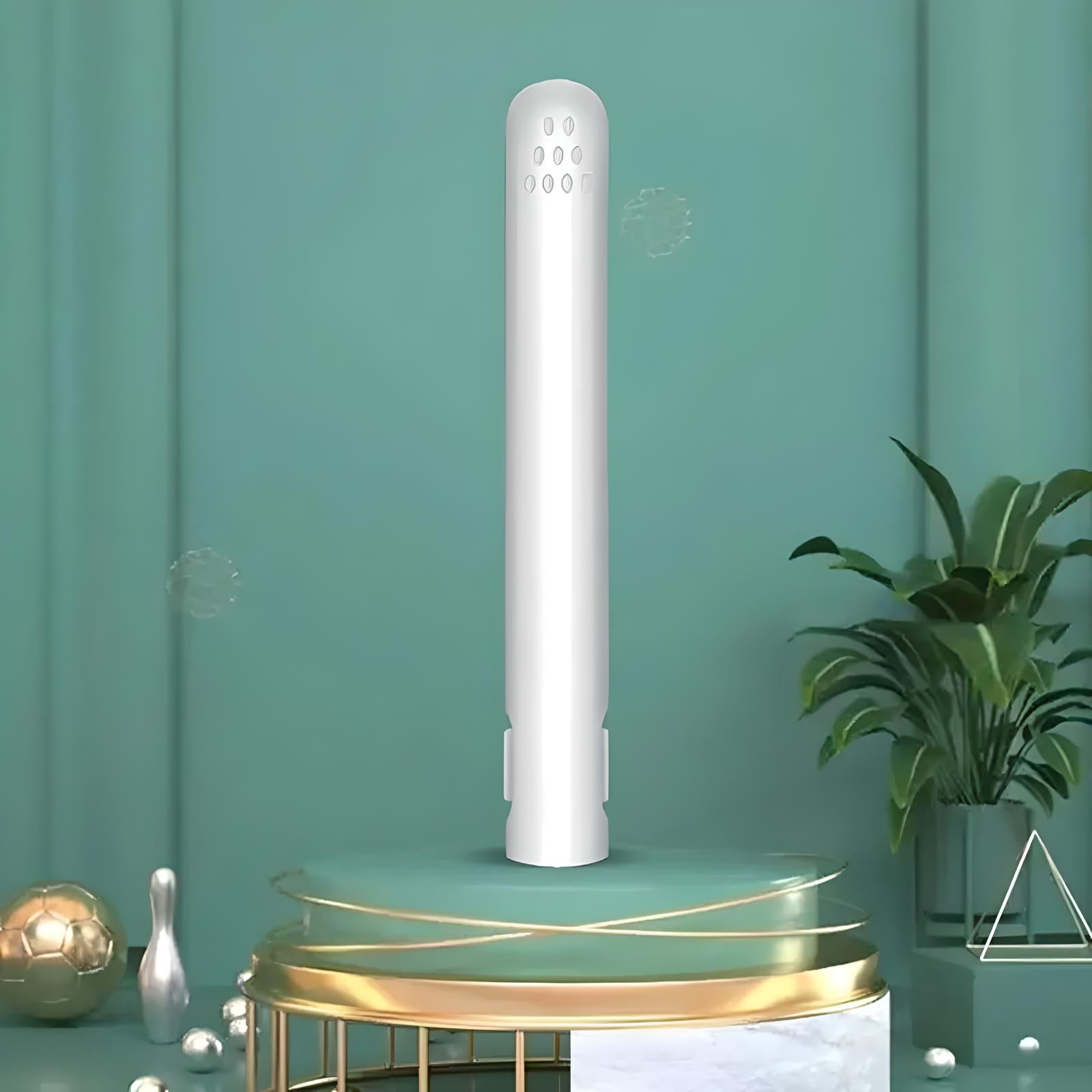 Sleek white air purifier on a stylish green and gold pedestal, modern home decor, indoor air quality improvement, minimalist design.