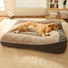 Golden Retriever sleeping on a large orthopedic dog bed in a cozy living room. Comfortable pet mattress, plush design, ideal for joint support.