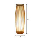 Modern bamboo table lamp with vertical slats, 15 inches tall, 4 inches wide, emits warm ambient light, perfect for home decor and lighting.