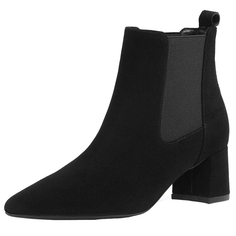 Black suede ankle boot with block heel and elastic side panel, perfect for stylish women's fall fashion. Elegant footwear for versatile outfits.