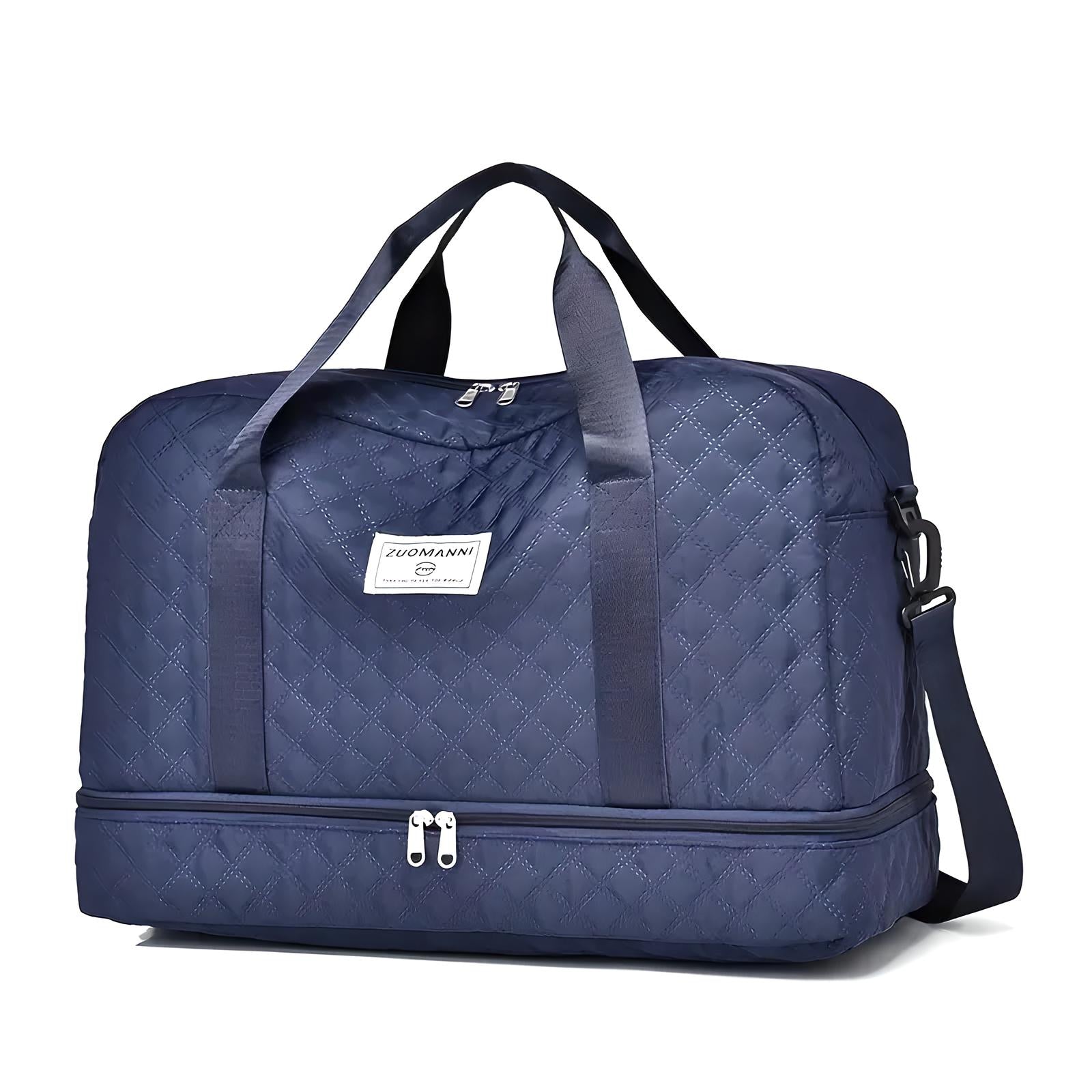 Navy blue quilted travel duffel bag with dual handles, adjustable shoulder strap, and zippered compartments. Ideal for luggage, gym, or weekend trips.