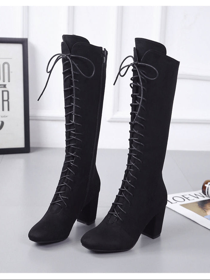 Black knee-high lace-up boots with block heels, perfect for stylish winter fashion. Women's footwear, elegant design, versatile for casual or formal wear.