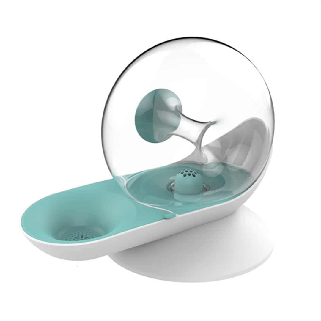 Modern pet water fountain with transparent dome and turquoise base, featuring a filtration system. Ideal for cats and dogs. Stylish pet hydration solution.