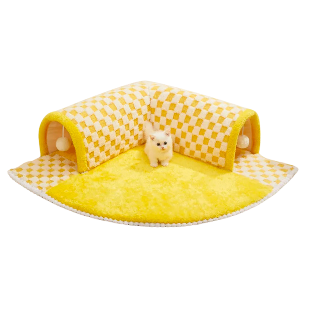 Cute kitten on a yellow checkered cat play mat with tunnels, perfect for pet entertainment and comfort. Ideal cat accessory for playful kittens.