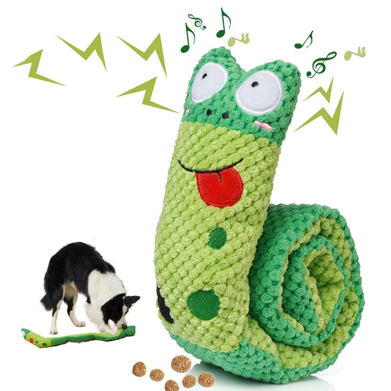 Green plush snake dog toy with musical notes, featuring a textured design and a playful tongue. Includes a dog interacting with the toy and treats.