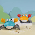 Colorful toy crabs with big eyes and movable claws on a sandy beach setting, perfect for children's playtime. Fun, educational, interactive beach toys.