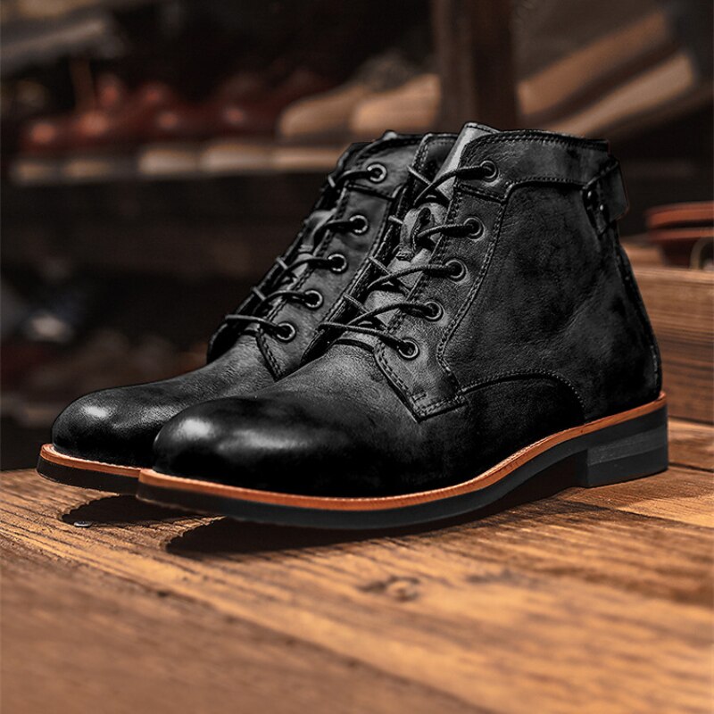 Black leather men's boots with lace-up design on wooden surface, featuring durable sole and sleek finish. Perfect for casual and formal wear.