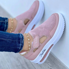 Pink women's slip-on sneakers with mesh design and white platform sole, featuring "Fashion" text. Stylish casual footwear for comfort and trend.