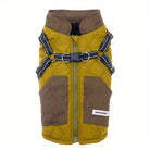 Quilted dog jacket with harness, olive green and brown, featuring adjustable straps and pockets. Ideal for pet fashion and outdoor protection.