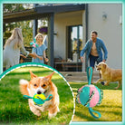 Family playing fetch with dogs using colorful interactive dog toy ball in backyard. Perfect for pet exercise, outdoor fun, and dog training.