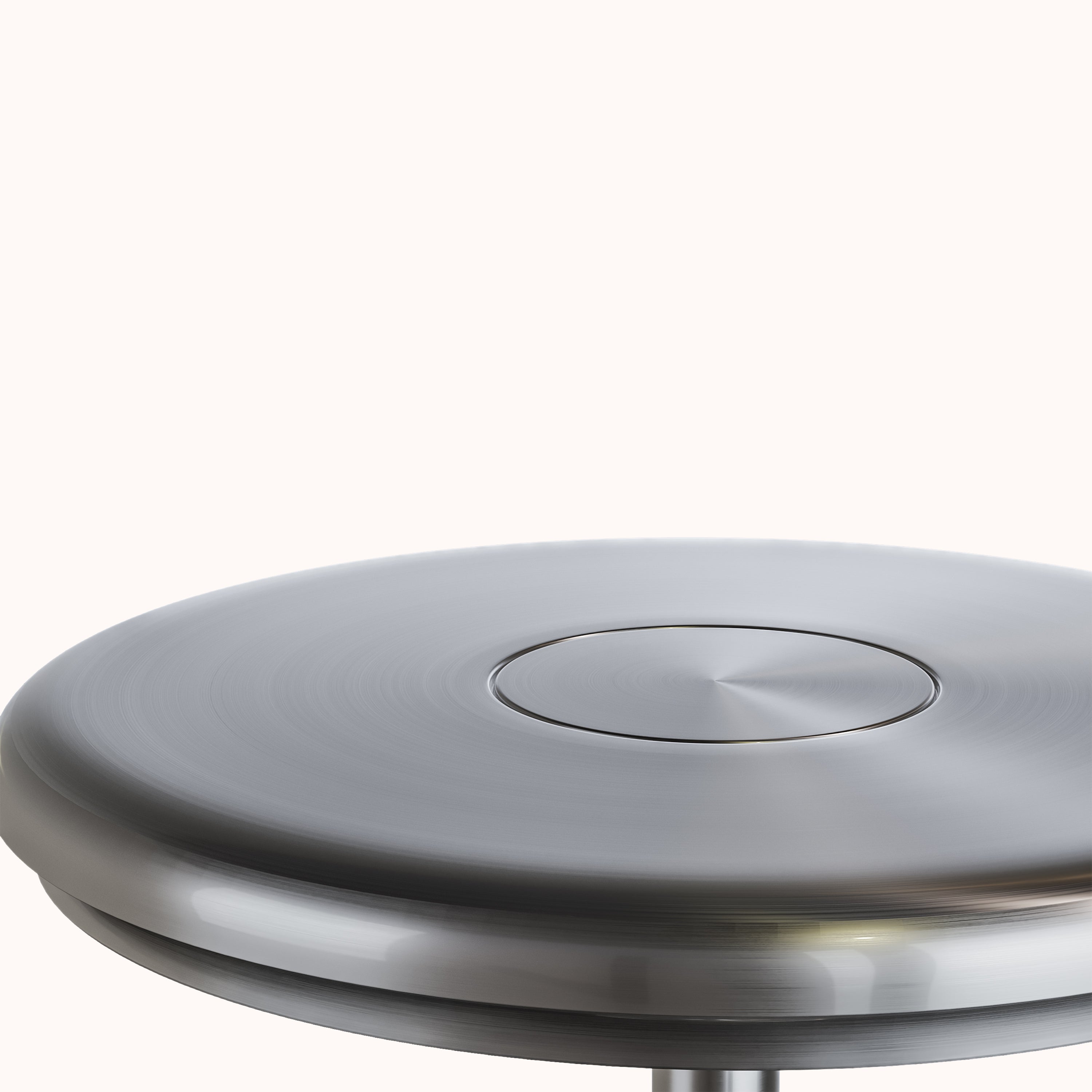 Sleek silver metal disc with a polished finish, featuring a central button. Modern minimalist design, ideal for contemporary home decor or technology.