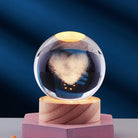 Glass storm cloud weather predictor on wooden base, heart-shaped crystal ball, home decor, unique gift, atmospheric forecasting device.