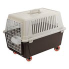 Pet travel carrier with wheels, durable plastic design, secure metal door, and ventilation slots. Ideal for safe and convenient pet transportation.