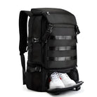 Black travel backpack with shoe compartment, multiple pockets, and adjustable straps. Ideal for hiking, gym, and outdoor activities. Durable and spacious design.