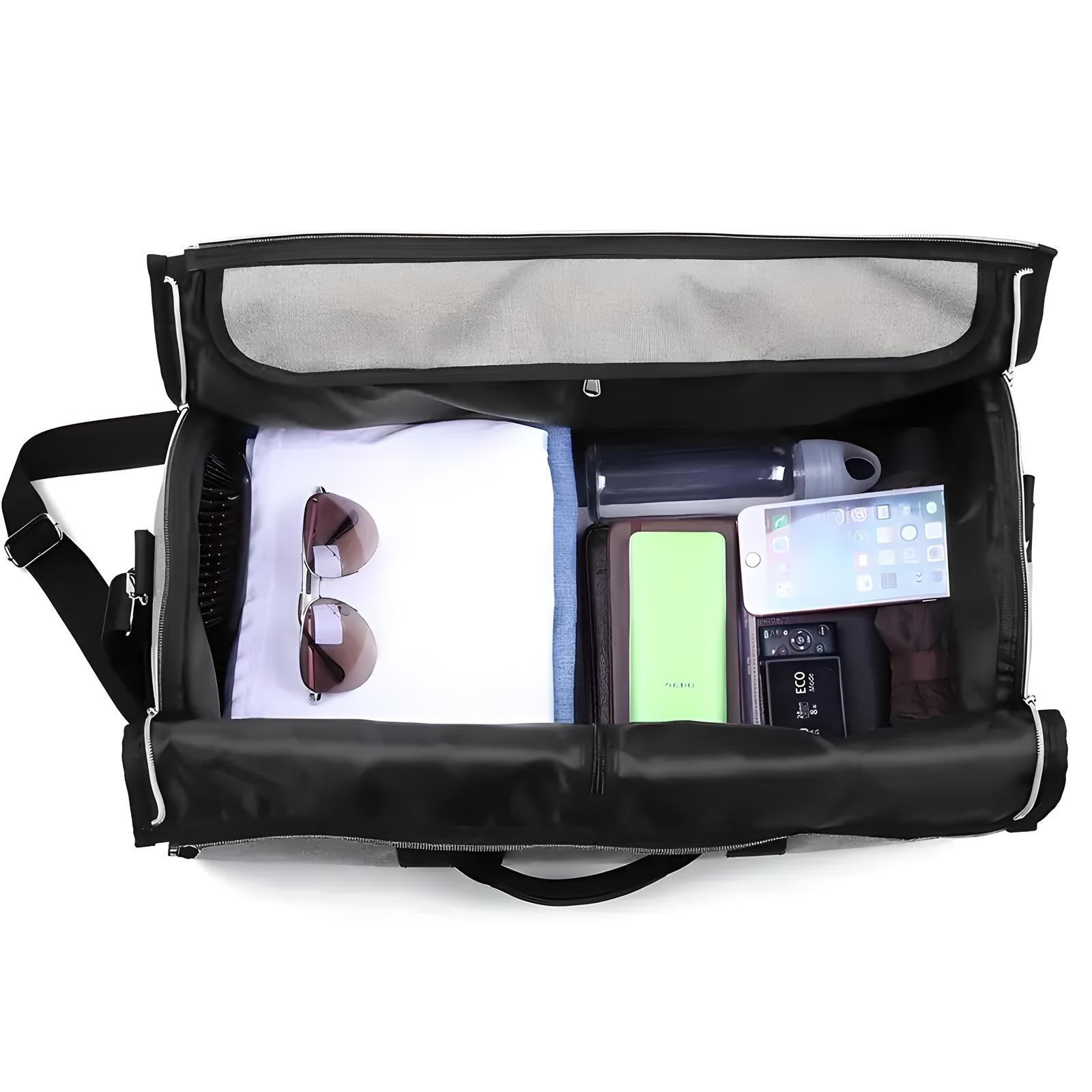 Open black travel duffel bag with organized compartments, containing sunglasses, water bottle, smartphone, power bank, and clothing. Ideal for travel.