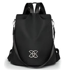 Sleek black backpack with modern design, featuring adjustable straps and a stylish silver logo. Perfect for travel, school, or work essentials.