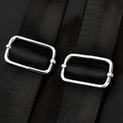 Black mesh belt with silver rectangular buckles, fashion accessory, close-up. Stylish adjustable belt for dresses, high-quality design.