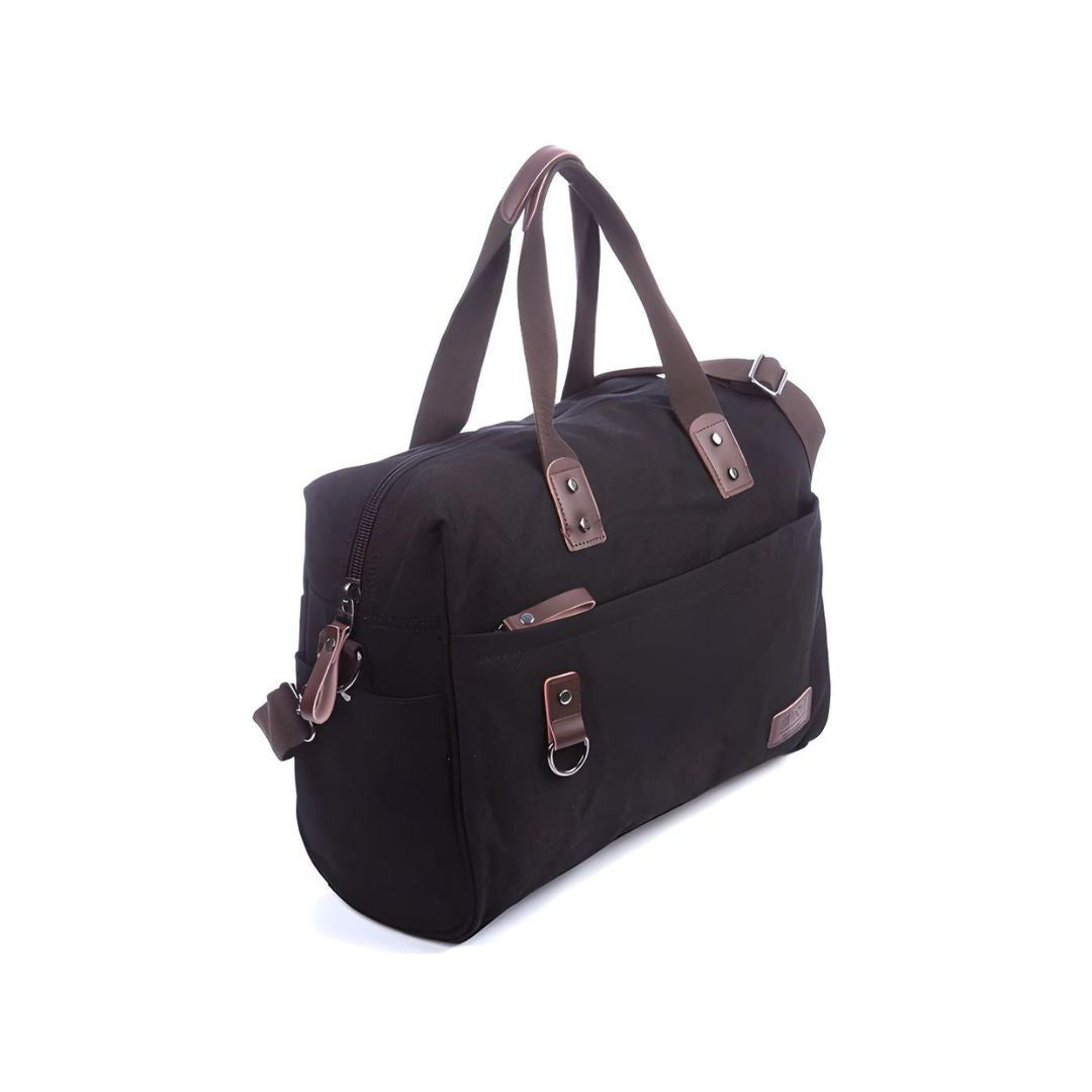 Black canvas duffel bag with brown leather accents, featuring a front pocket, sturdy handles, and adjustable shoulder strap. Ideal for travel or gym use.