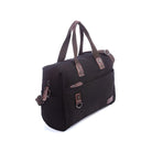 Black canvas duffel bag with brown leather accents, featuring a front pocket, sturdy handles, and adjustable shoulder strap. Ideal for travel or gym use.