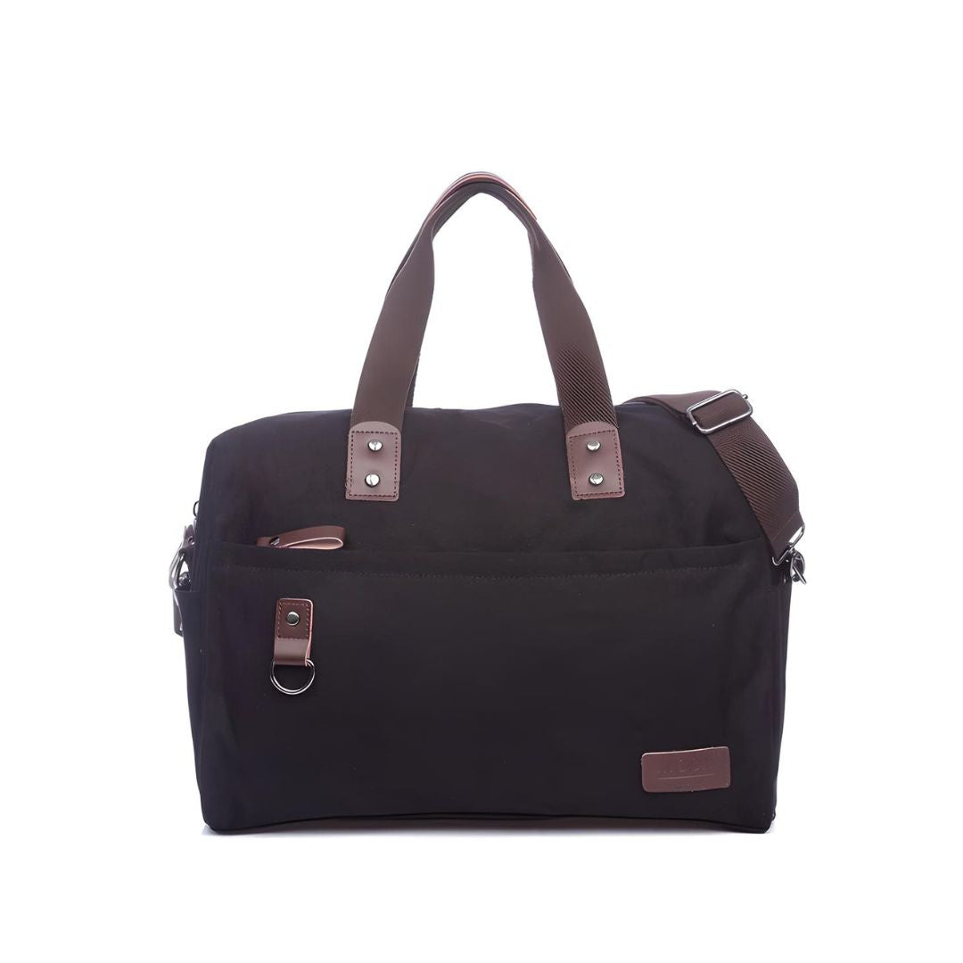 Black canvas duffel bag with brown leather handles and adjustable shoulder strap, featuring front pocket and metal hardware. Ideal for travel or gym use.