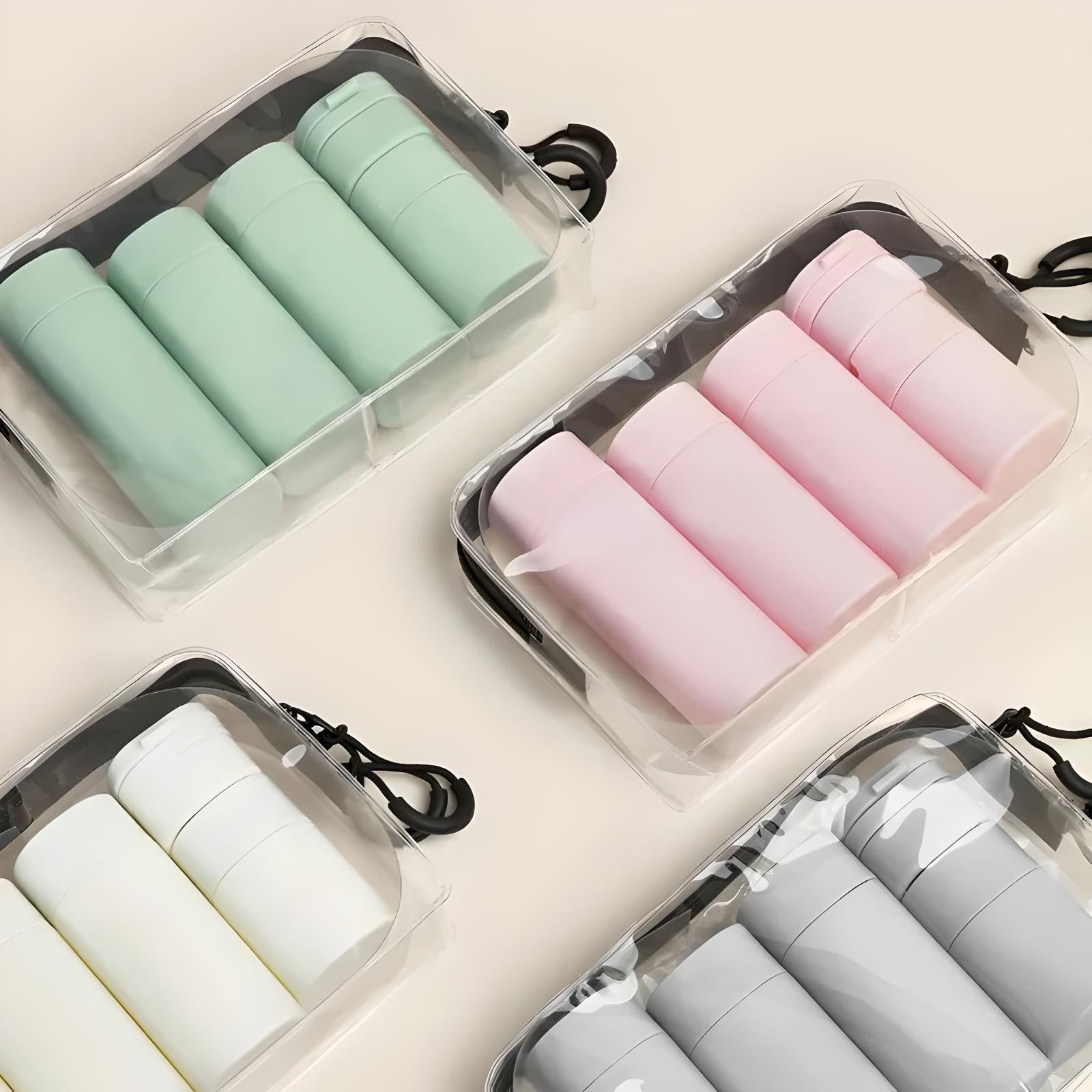 Clear travel toiletry bags with pastel-colored bottles; mint green, pink, white, and gray. Ideal for organizing cosmetics and toiletries.