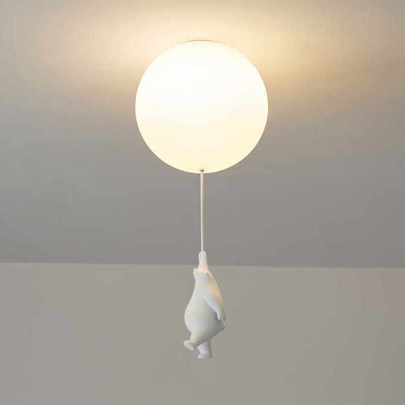 Modern ceiling light fixture with a round globe design and a playful penguin pull switch. Ideal for contemporary home decor and ambient lighting.