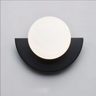 Modern minimalist wall lamp with a circular white light and black semicircular base, ideal for contemporary home decor and ambient lighting solutions.