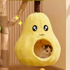 Cute cat inside a pear-shaped plush cat bed hanging from a wooden cat tree, featuring a kawaii face design. Cozy pet furniture for playful kittens.