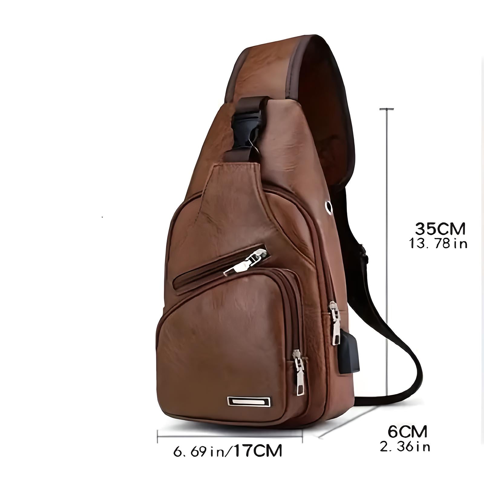 Brown leather sling backpack with multiple zippered compartments, adjustable strap, and compact design. Ideal for travel and daily use. Dimensions: 35x17x6 cm.