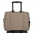 Beige travel bag on suitcase handle, featuring sleek design, durable material, and convenient side pocket. Ideal for business trips and travel.