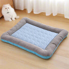 Striped pet bed with blue quilted center on wooden floor, ideal for cats and small dogs. Cozy, comfortable design enhances pet relaxation and sleep.