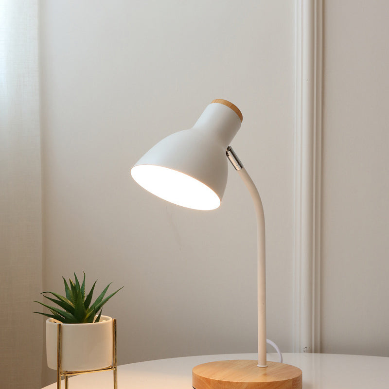 Modern white desk lamp with wooden base on a round table, next to a small potted succulent. Ideal for home office lighting and minimalist decor.