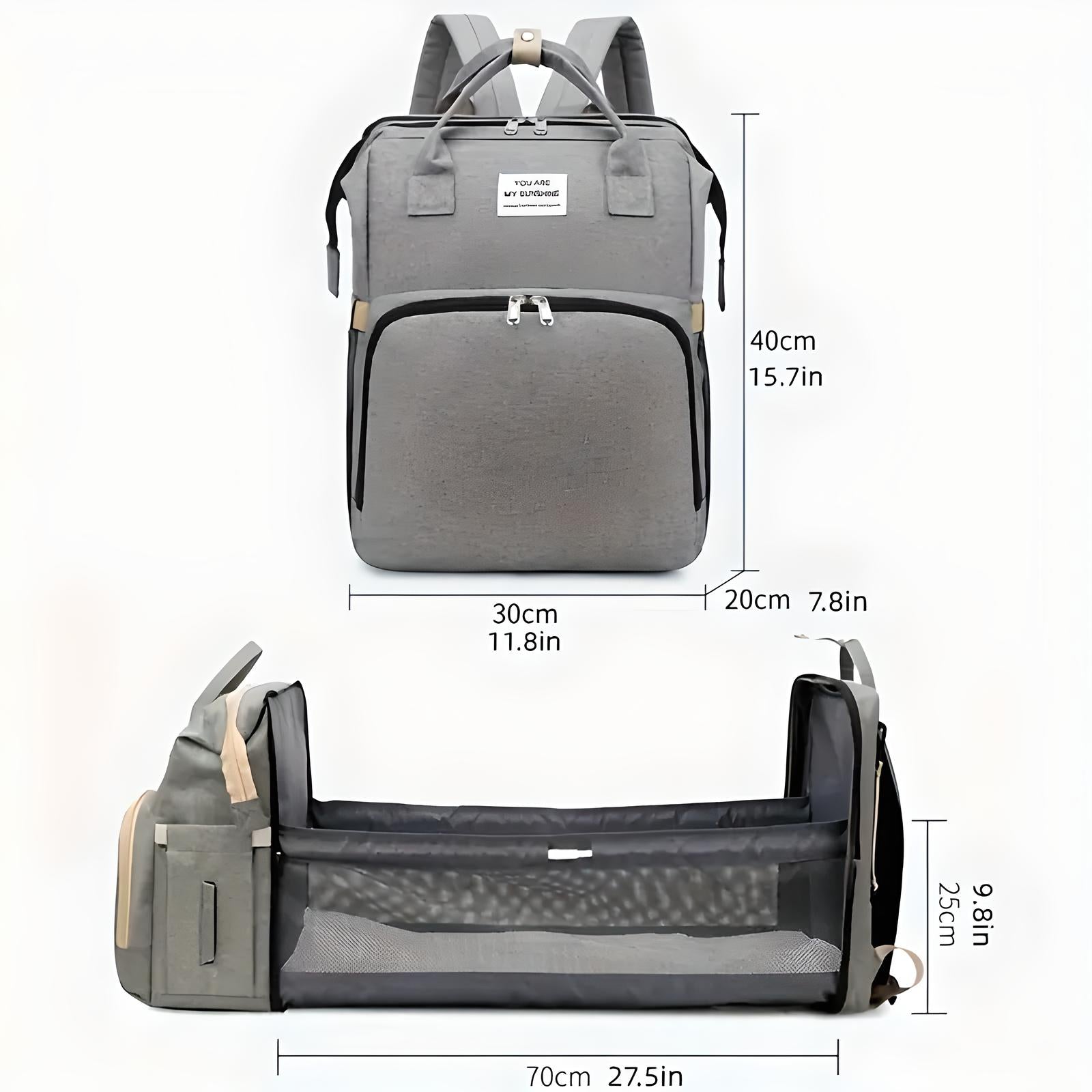 Gray multifunctional diaper bag backpack with foldable baby bed, USB charging port, and spacious compartments. Ideal for travel and baby care.