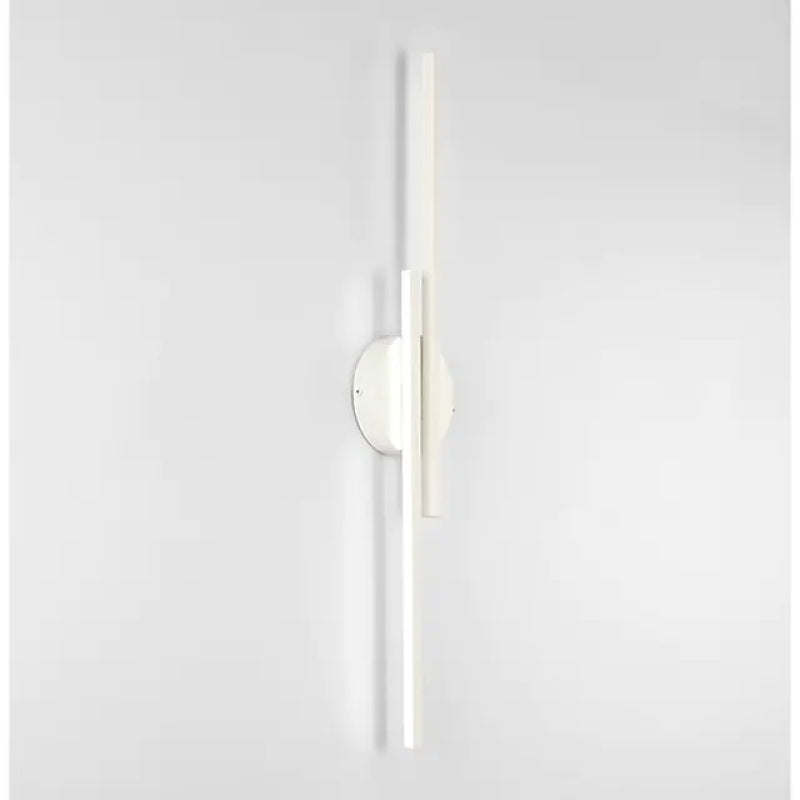 Modern minimalist white wall sconce with vertical LED light bars, sleek design, energy-efficient lighting fixture for contemporary interiors.