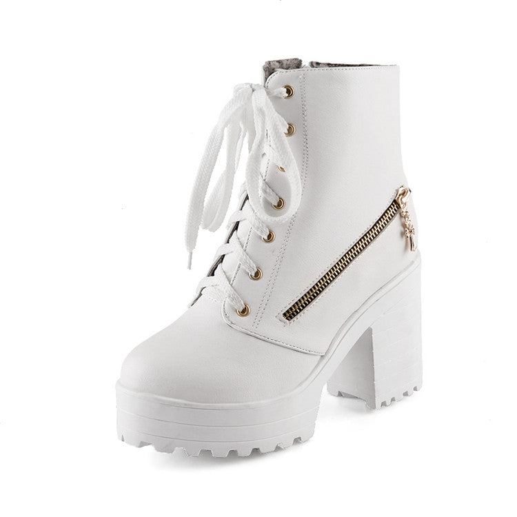 White platform ankle boot with chunky heel, lace-up front, side zipper, and gold eyelets. Stylish women's footwear for fashion-forward looks.