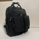 Black nylon backpack with multiple zippered compartments and front pockets, ideal for travel or school. Durable, stylish, and spacious design.