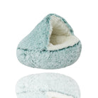 Cozy teal pet bed with plush faux fur, cave design for cats and small dogs, perfect for comfort and warmth. Ideal for pet relaxation and sleep.