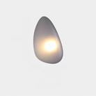 Modern minimalist wall sconce with soft ambient LED light, teardrop shape, sleek design, ideal for contemporary home decor and energy-efficient lighting.