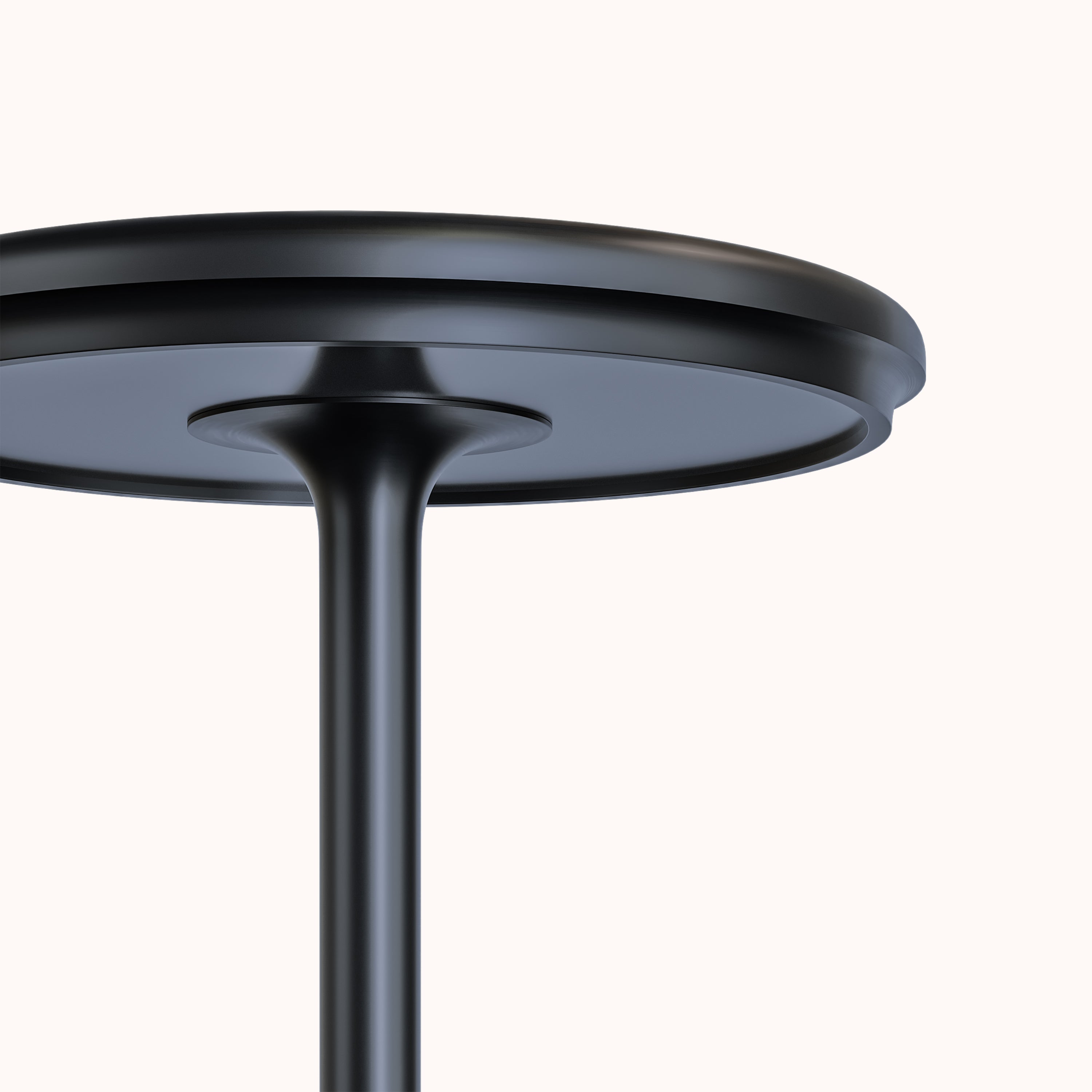 Sleek black round metal table with minimalist design, featuring a sturdy pedestal base. Modern furniture, contemporary home decor, stylish table.