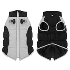 Reversible dog winter coat, black and gray, with zipper and harness holes. Warm, padded pet jacket for small to medium dogs. Durable, stylish design.