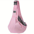 Pink pet sling carrier bag with adjustable strap, checkered interior, and secure buckle. Ideal for small pets, travel, and hands-free convenience.