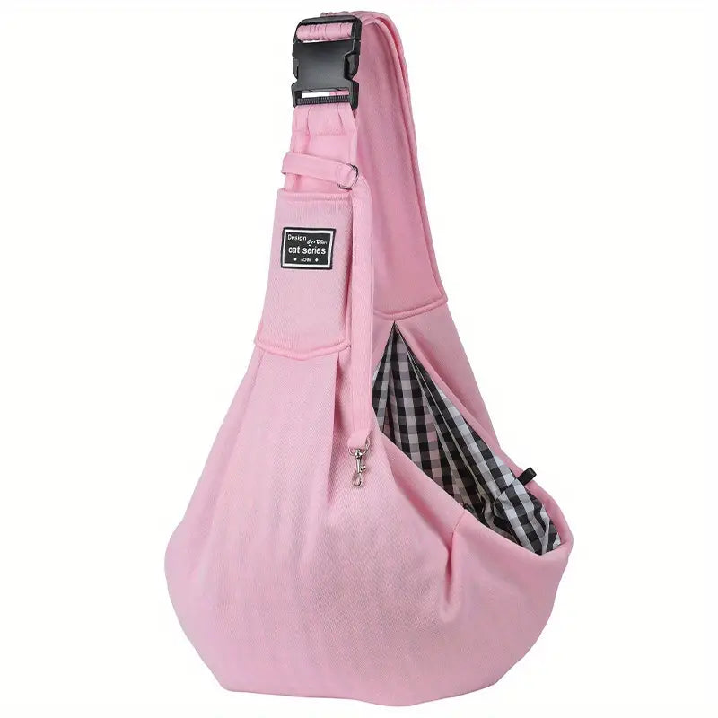 Pink pet sling carrier bag with adjustable strap, checkered interior, and secure buckle. Ideal for small pets, travel, and hands-free convenience.