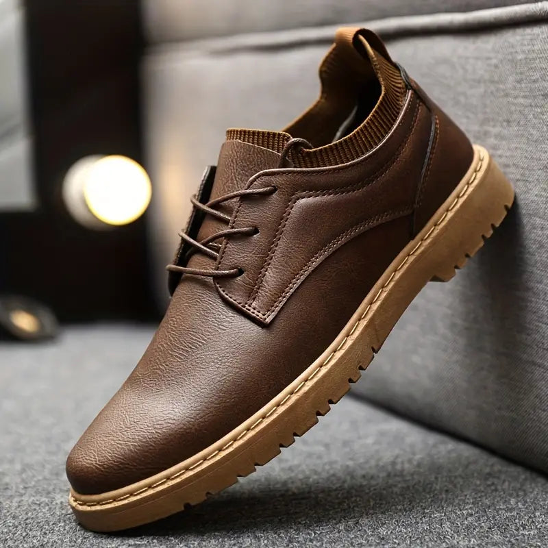 Men's brown leather casual shoe with lace-up design, durable rubber sole, and stylish stitching, perfect for everyday wear and comfort.
