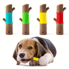 Beagle puppy chewing on a yellow dog toothbrush toy; four colorful dog toothbrush sticks displayed above. Pet dental care, chew toy for dogs.