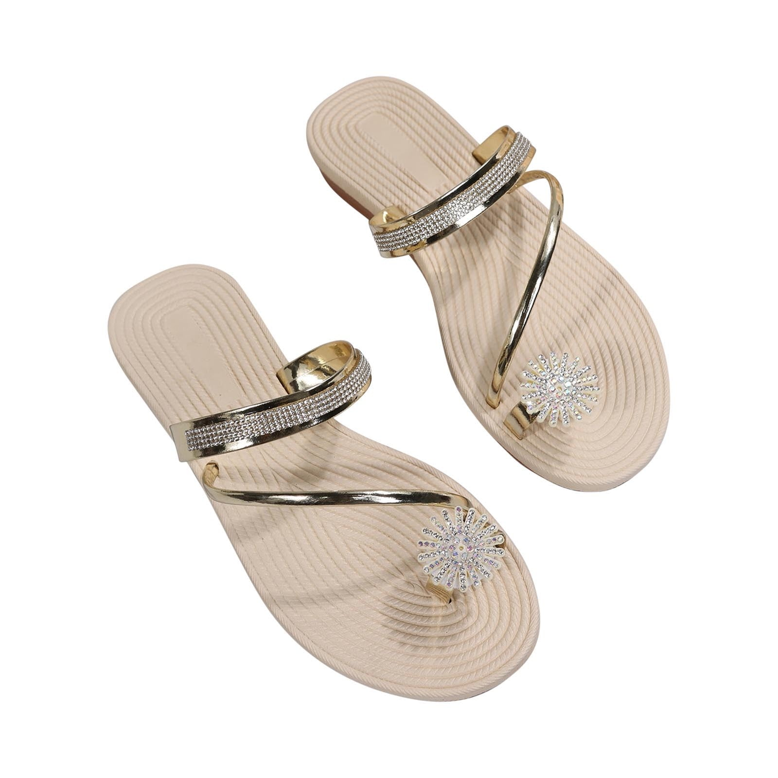 Beige women's sandals with rhinestone embellishments, metallic straps, and floral design. Stylish summer footwear, perfect for casual wear.