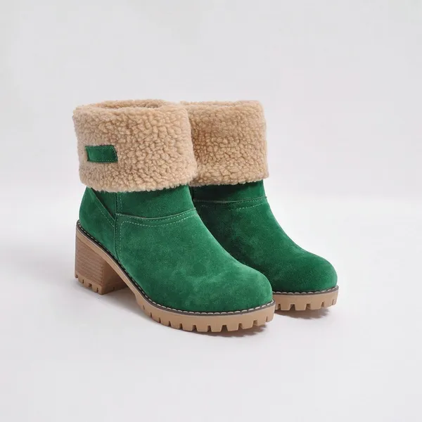 Green suede ankle boots with faux fur lining, block heel, and lug sole. Stylish winter footwear, perfect for cold weather fashion.