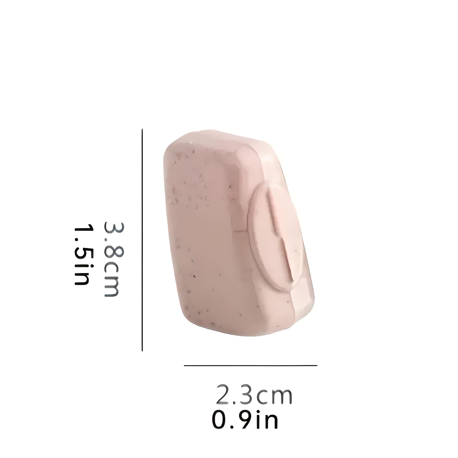 Compact pink soap bar with exfoliating properties, measuring 3.8cm x 2.3cm. Ideal for travel, skincare, and gentle cleansing.