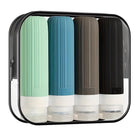 Travel toiletry bottles set in a clear zippered case, featuring four silicone squeeze bottles in green, blue, brown, and black, ideal for travel essentials.