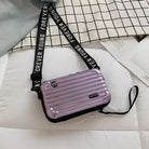 Compact purple crossbody bag with ribbed design, adjustable "Forever Young" strap, and sleek zipper closure on a checkered background. Stylish travel accessory.