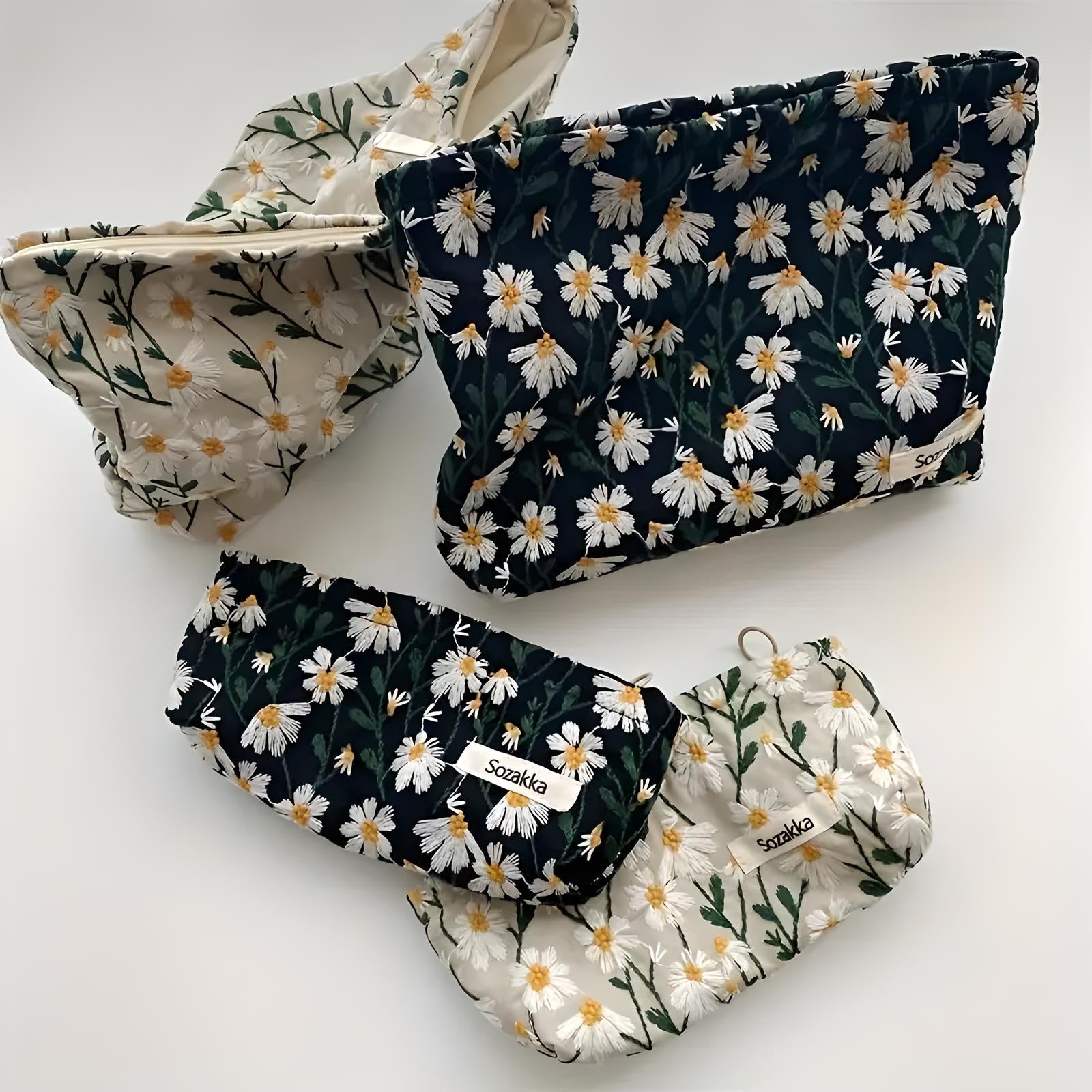 Floral patterned reusable bags set featuring daisies, eco-friendly storage solution, sustainable fabric pouches for travel and organization.